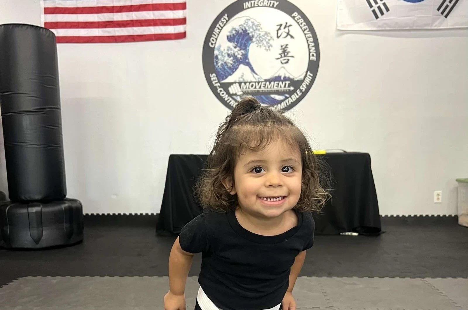 Kids learning sportsmanship through martial arts
